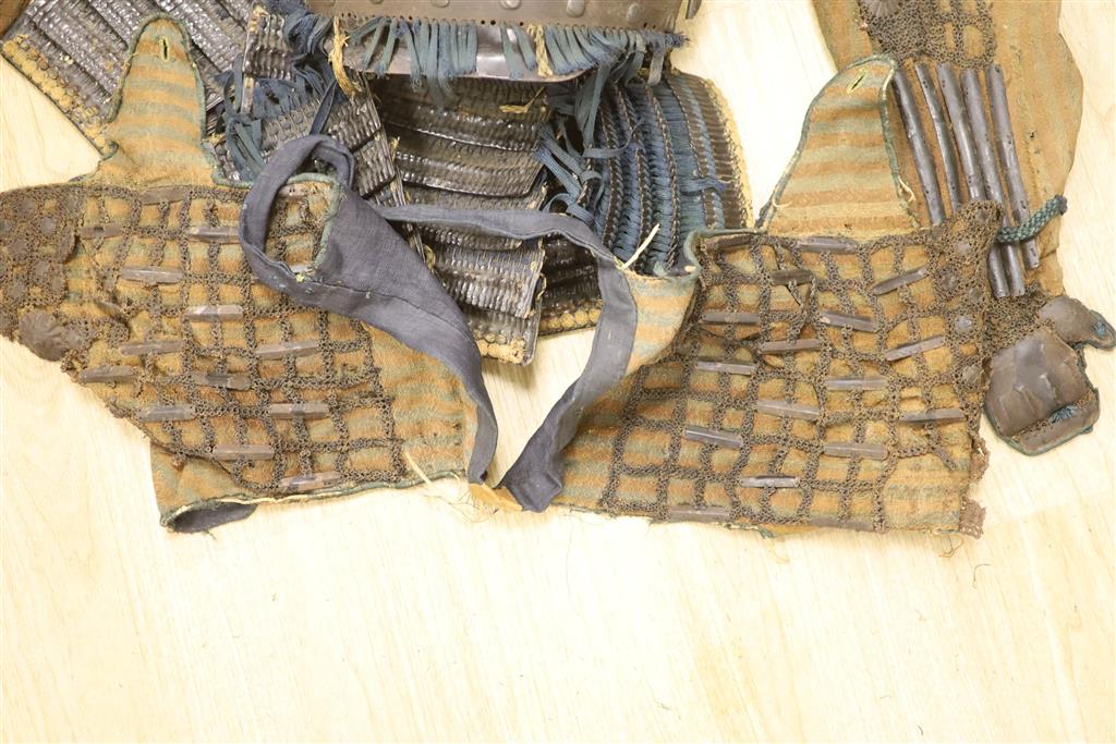 A Japanese iron armour Okegawa-do (Yoko-Hagi-horizontal make) 17th or 18th century, iron laminated breast and back plates with